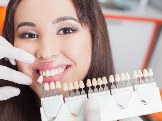 Young woman getting dental veneers from her cosmetic dentist