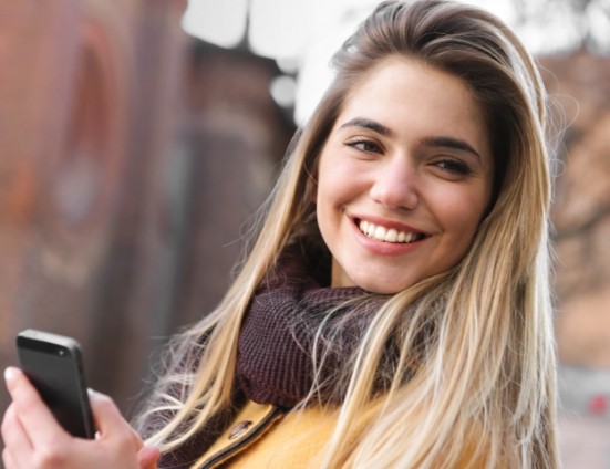 Smiling blonde woman in scarf