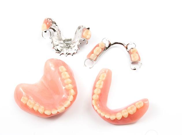 Sets of dentures against a white background