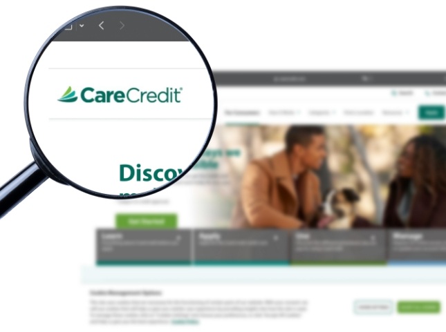 Magnifying glass showing Care Credit logo on website