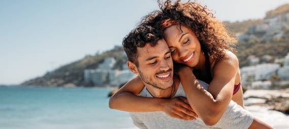 Man and woman embracing on the beach