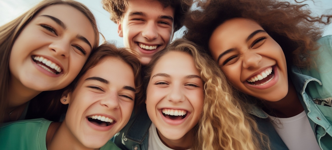 Group of young adults smiling outdoors